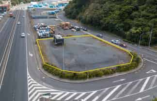 Fenced Yard Next to Motorway