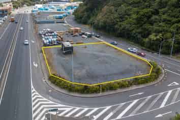 Fenced Yard Next to Motorway