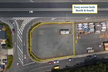 Fenced Yard Next to Motorway