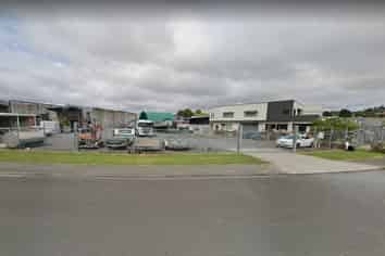 METALLED YARD WITH SMALL BUILDINGS