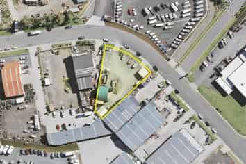 METALLED YARD WITH SMALL BUILDINGS